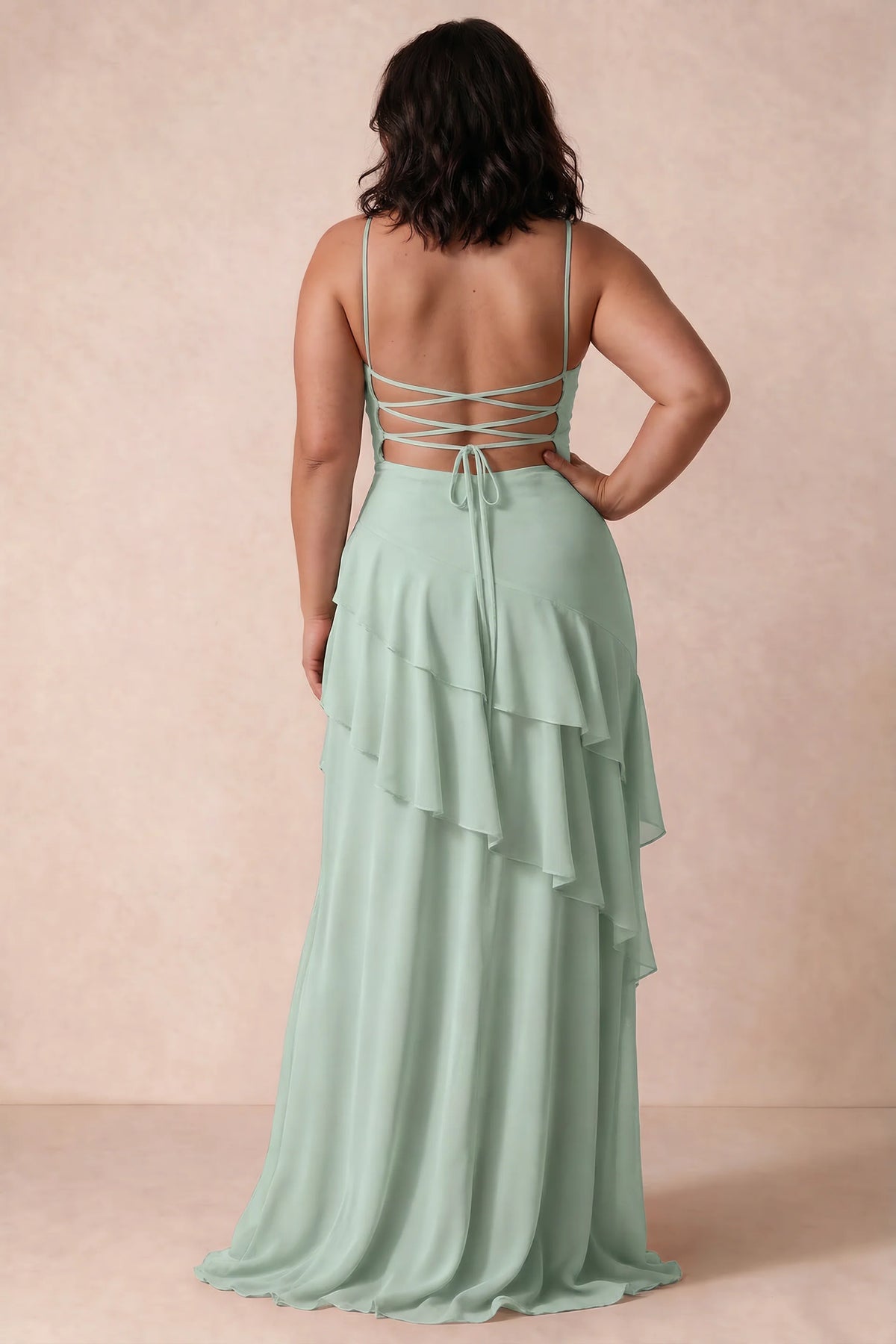 Rear view on a second model of Rosalie agave tiered ruffle maxi dress with a long flowing skirt