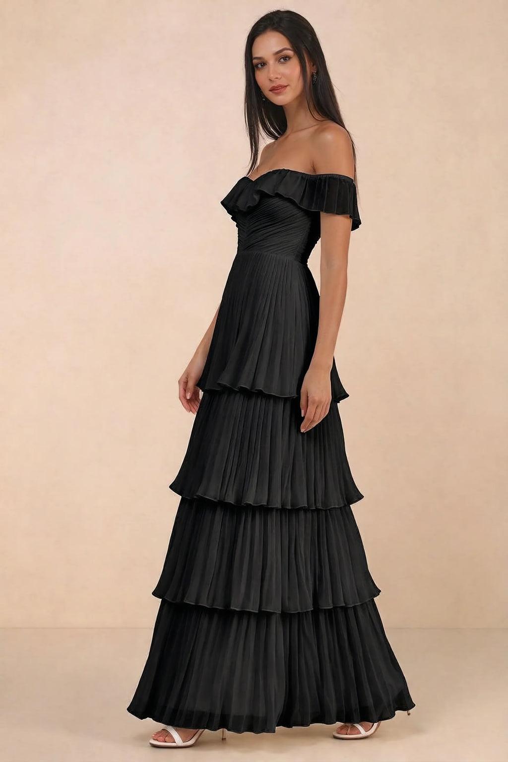 Front studio view of Seraphina black tiered ruffle maxi dress with a long flowing skirt