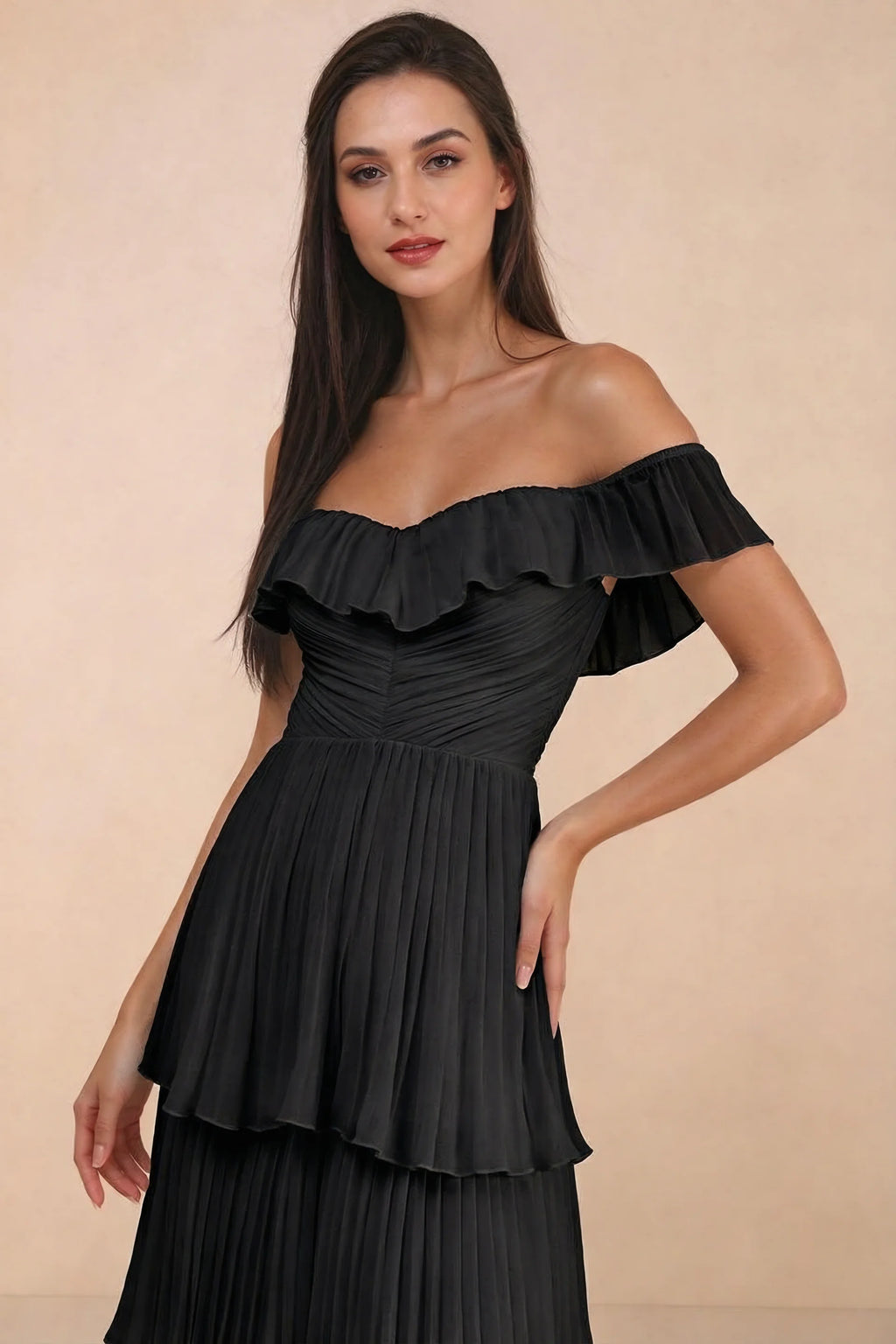 Close-up of shallow sweetheart neckline and off-shoulder ruffle and tiered skirt of Seraphina black tiered ruffle maxi dress