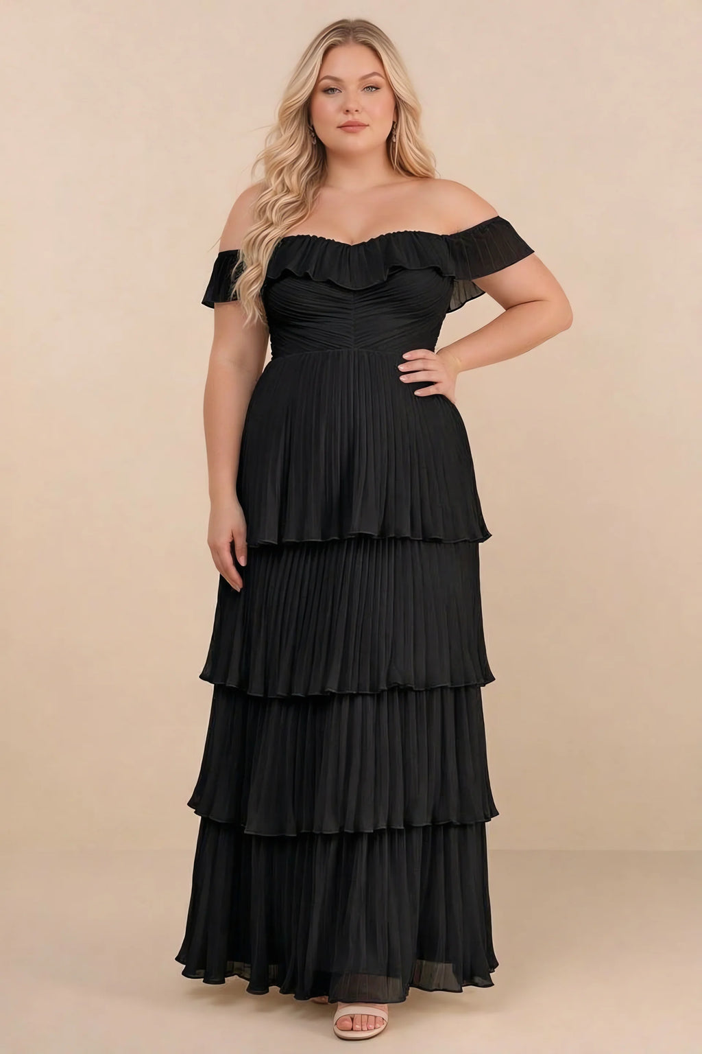 Front view on a second model of Seraphina black tiered ruffle maxi dress with a long flowing skirt
