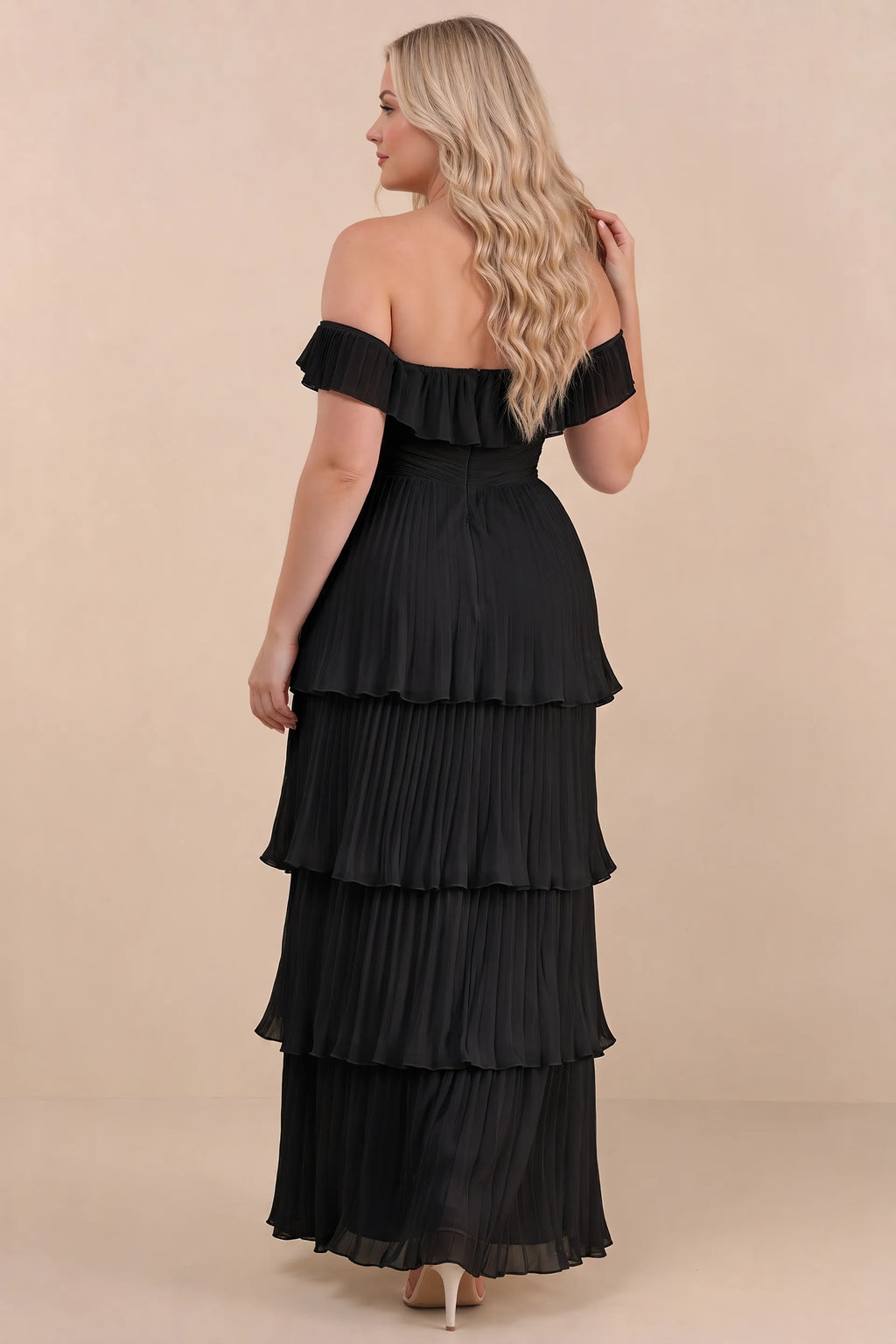 Rear view on a second model of Seraphina black tiered ruffle maxi dress with a long flowing skirt