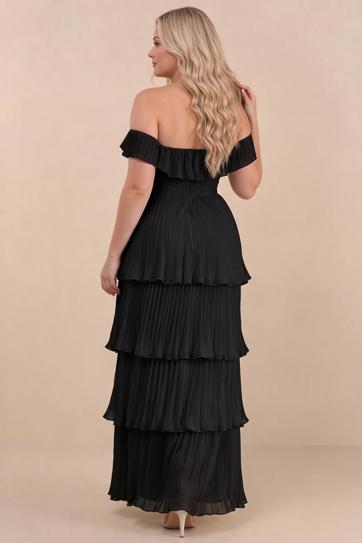 Rear view on a second model of Seraphina black tiered ruffle maxi dress with a long flowing skirt