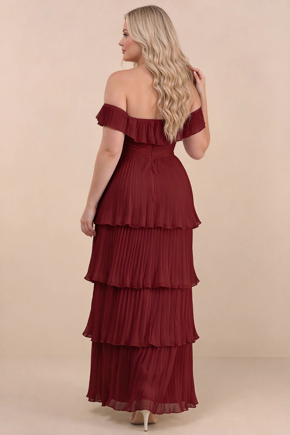 Rear view on a second model of Seraphina burgundy tiered ruffle maxi dress with a long flowing skirt