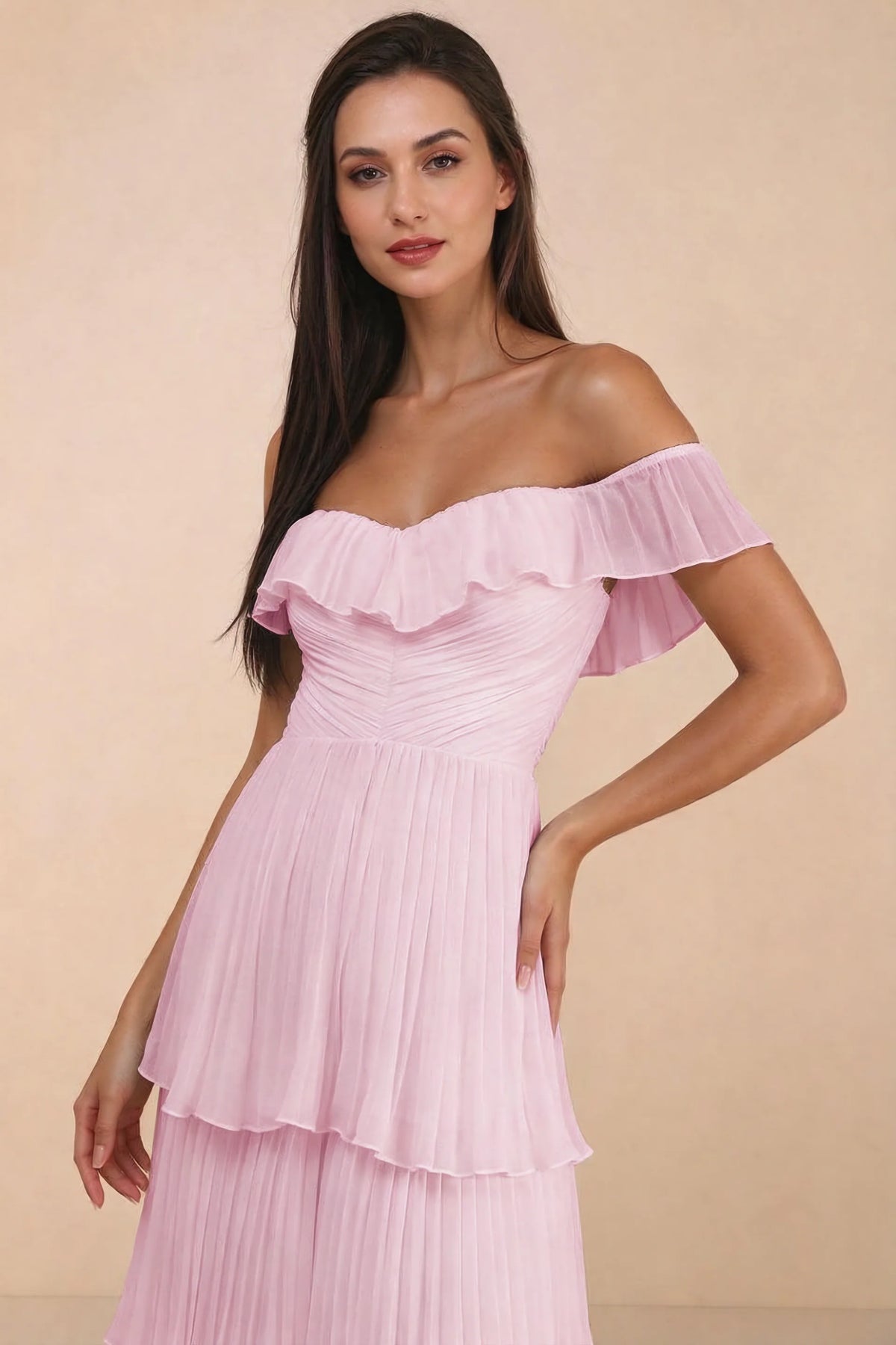 Close-up of shallow sweetheart neckline and off-shoulder ruffle and tiered skirt of Seraphina candy pink tiered ruffle maxi dress