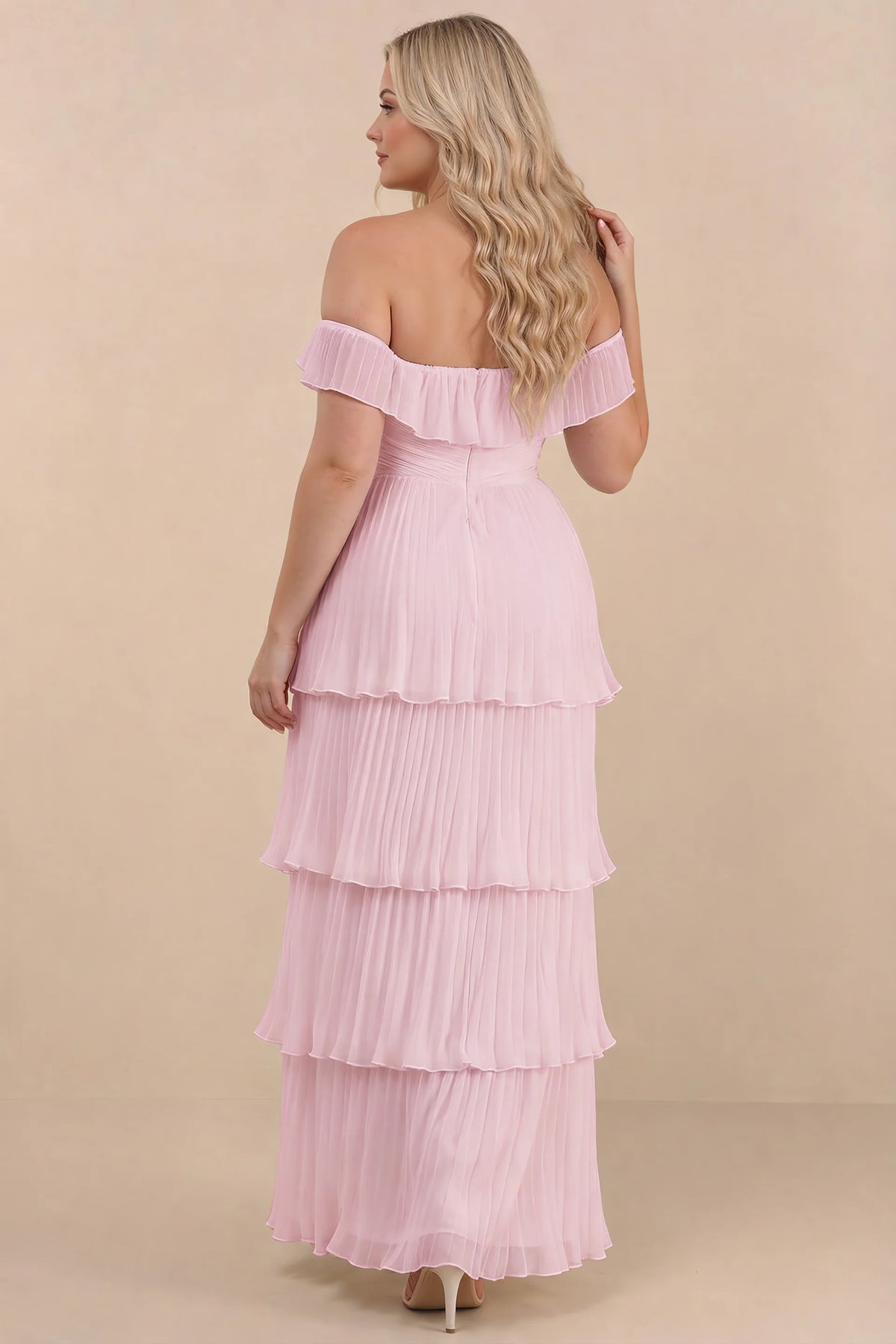 Rear view on a second model of Seraphina candy pink tiered ruffle maxi dress with a long flowing skirt