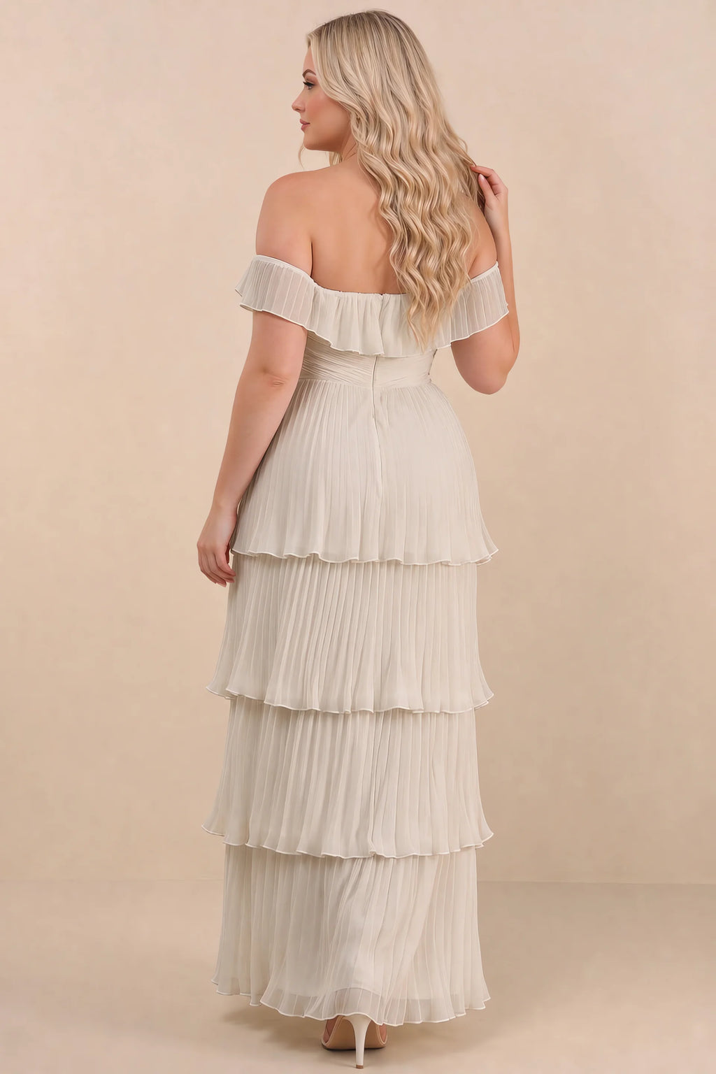 Rear view on a second model of Seraphina cream tiered ruffle maxi dress with a long flowing skirt