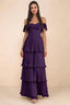 Front studio view of Seraphina grape tiered ruffle maxi dress with a long flowing skirt
