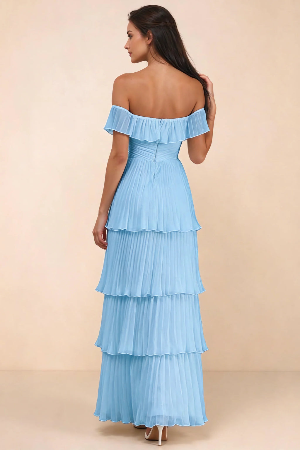 Rear studio view of Seraphina haze blue tiered ruffle maxi dress with a long flowing skirt