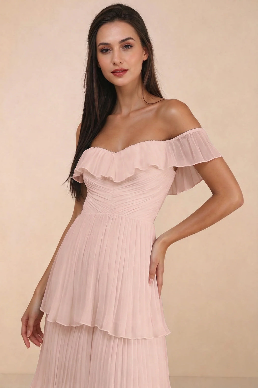 Close-up of shallow sweetheart neckline and off-shoulder ruffle and tiered skirt of Seraphina haze pink tiered ruffle maxi dress