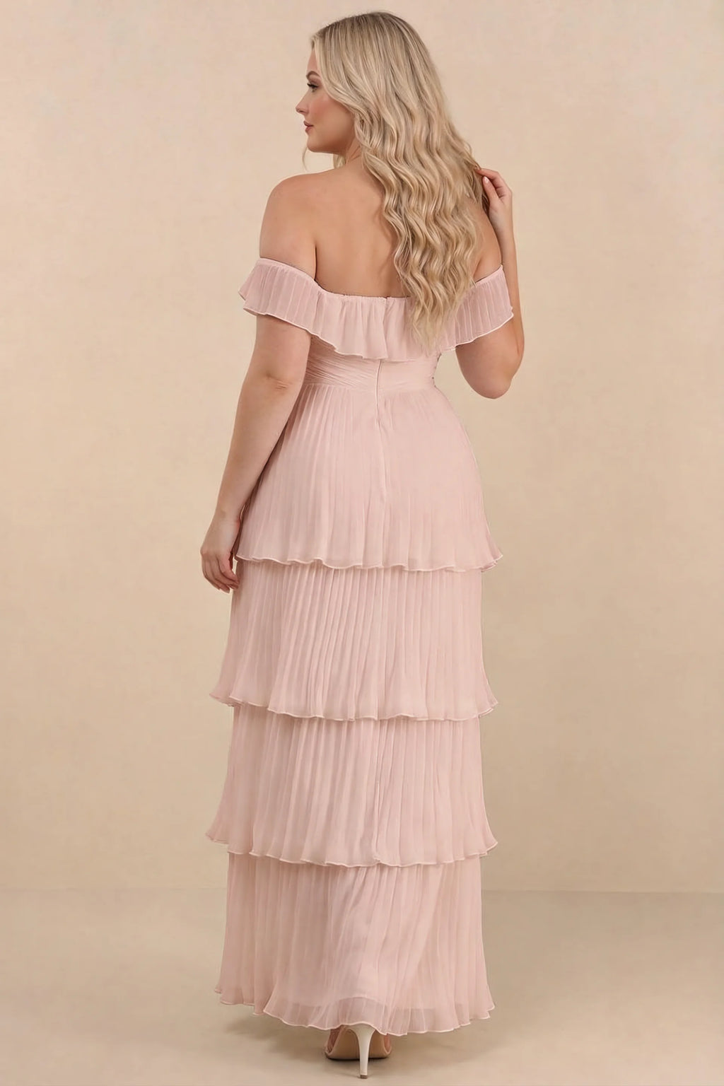 Rear view on a second model of Seraphina haze pink tiered ruffle maxi dress with a long flowing skirt