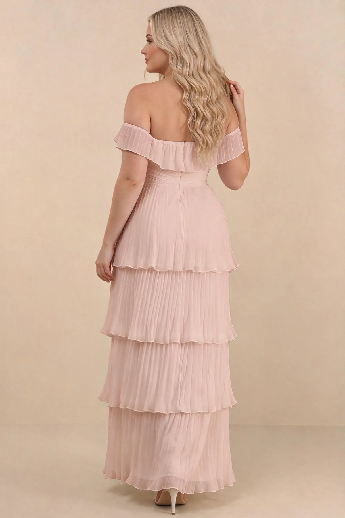 Rear view on a second model of Seraphina haze pink tiered ruffle maxi dress with a long flowing skirt