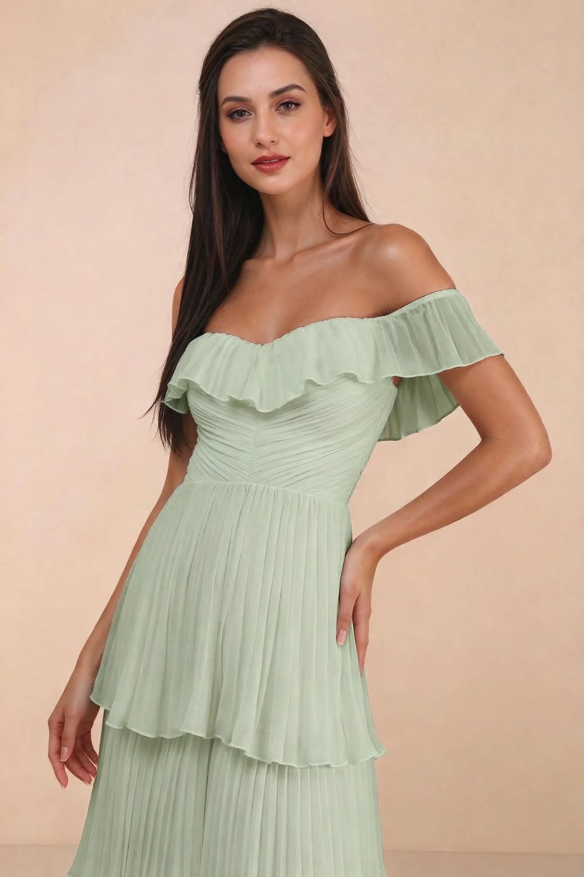 Close-up of shallow sweetheart neckline and off-shoulder ruffle and tiered skirt of Seraphina light green tiered ruffle maxi dress