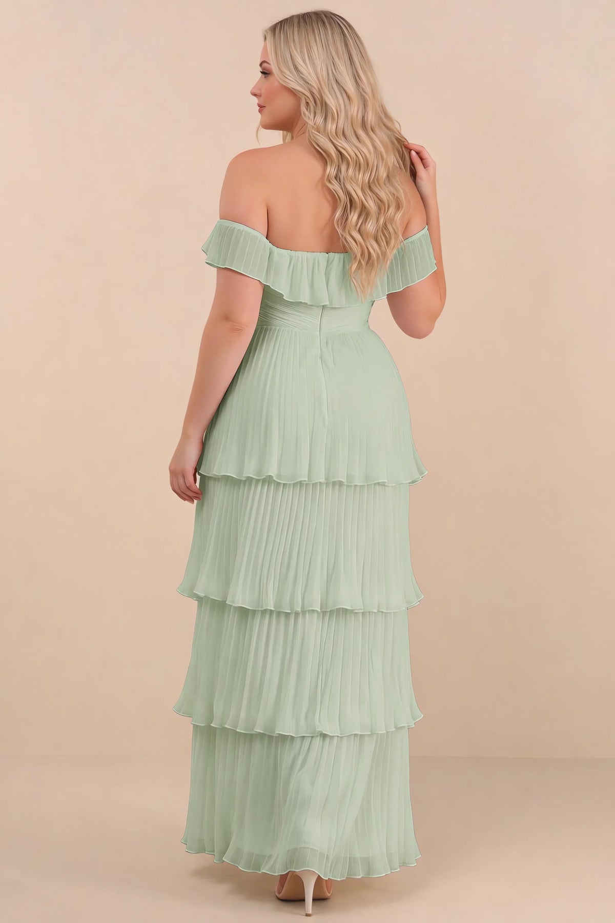 Rear view on a second model of Seraphina light green tiered ruffle maxi dress with a long flowing skirt