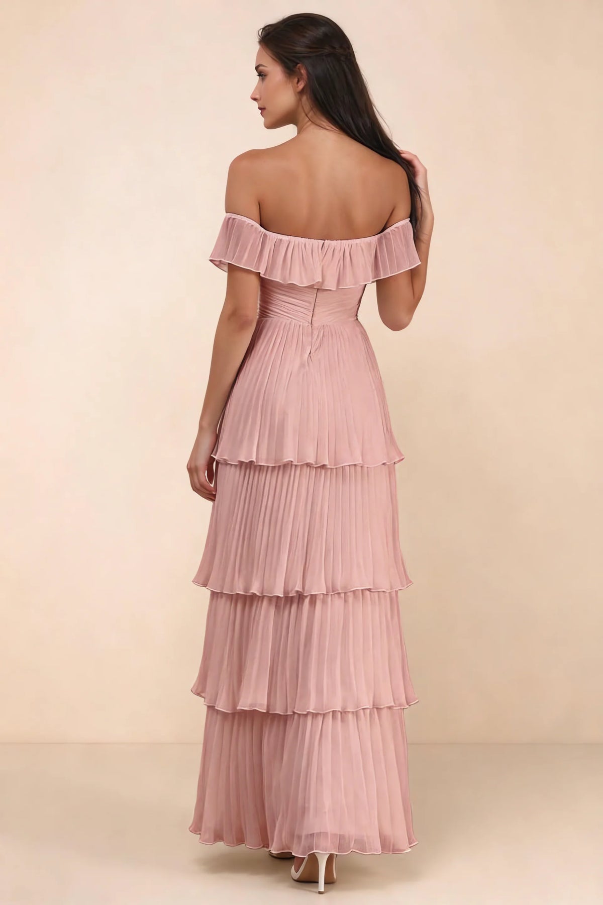 Rear studio view of Seraphina light pink tiered ruffle maxi dress with a long flowing skirt