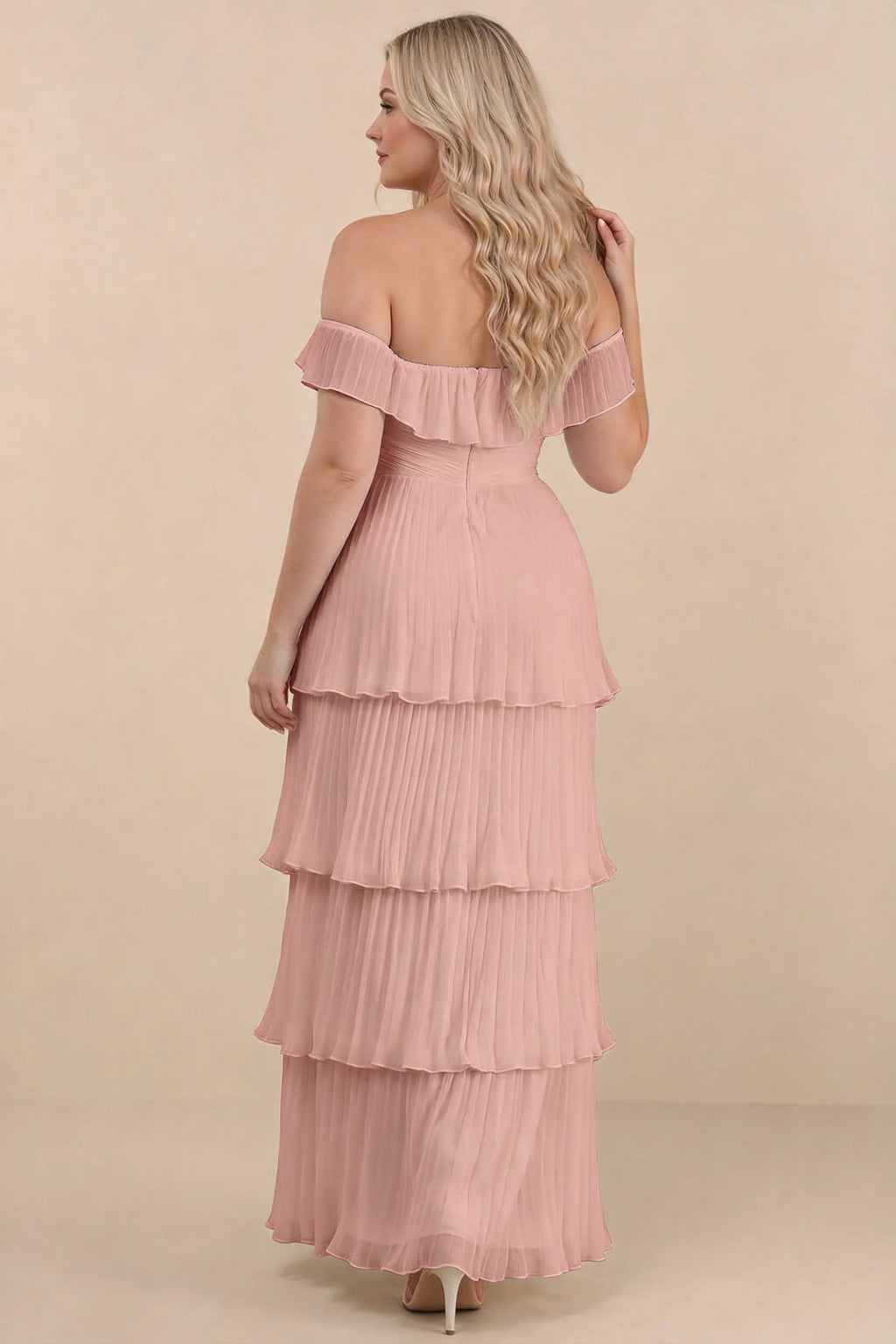 Rear view on a second model of Seraphina light pink tiered ruffle maxi dress with a long flowing skirt