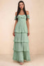 Front studio view of Seraphina matcha green tiered ruffle maxi dress with a long flowing skirt