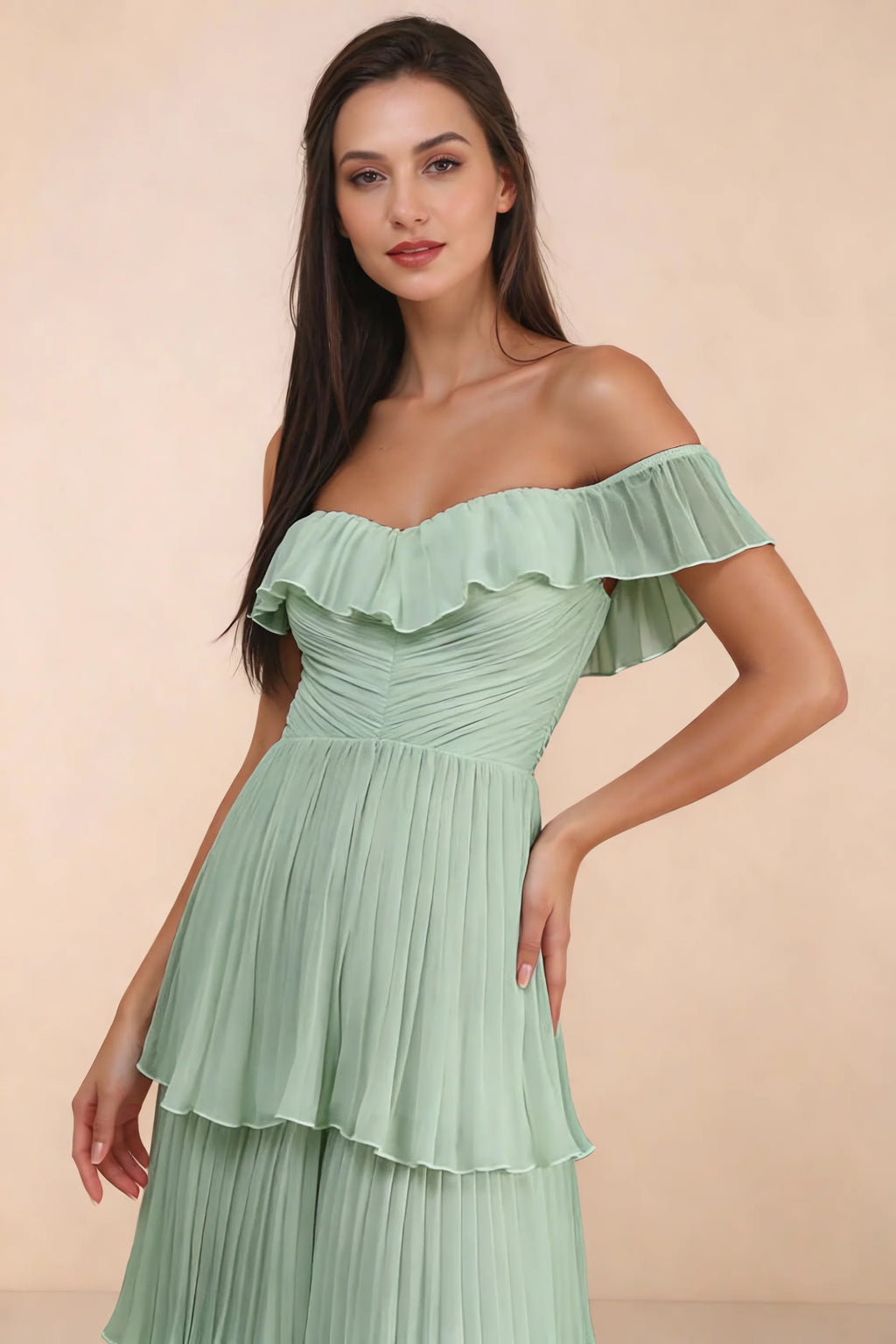 Close-up of shallow sweetheart neckline and off-shoulder ruffle and tiered skirt of Seraphina matcha green tiered ruffle maxi dress