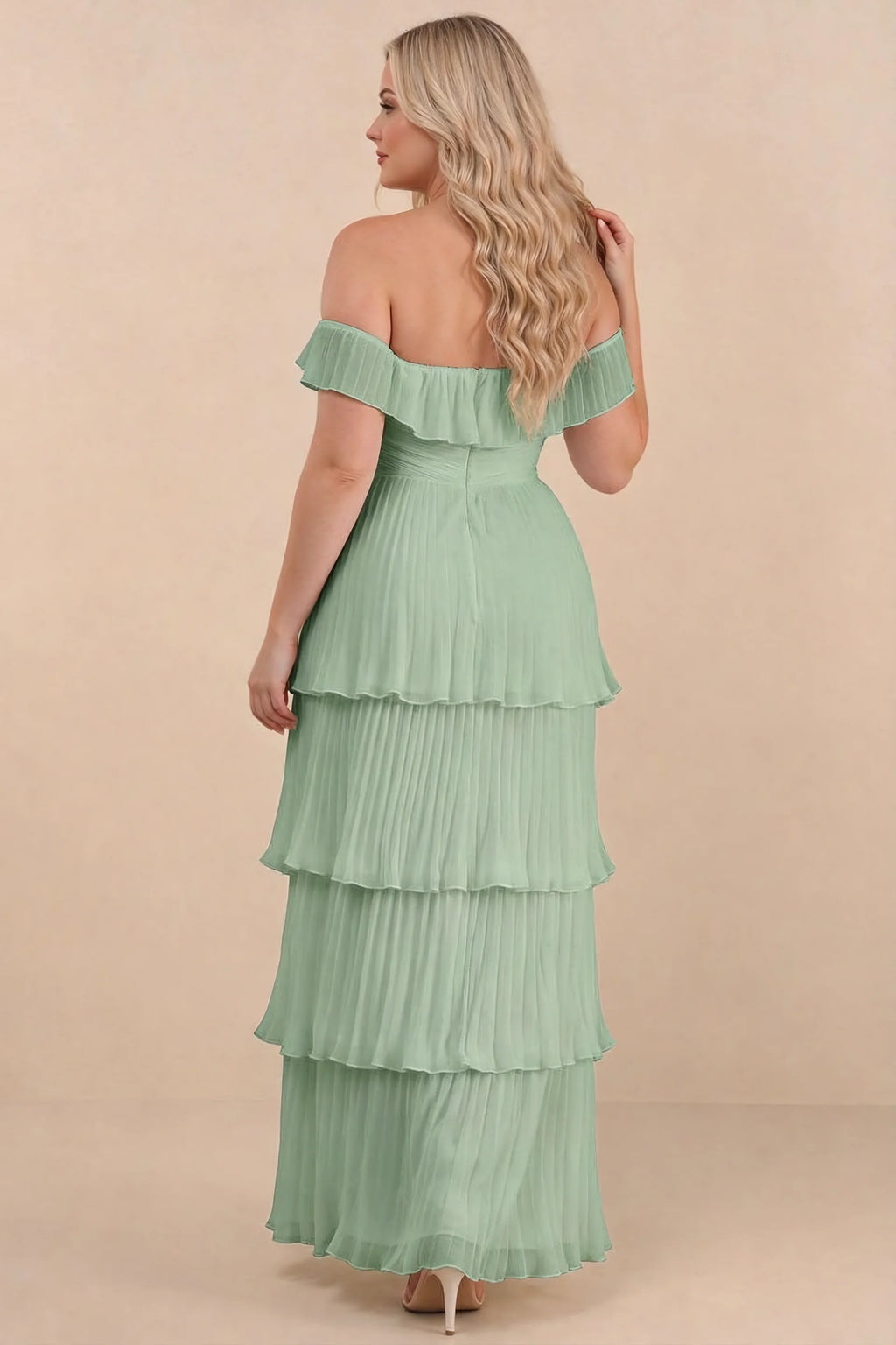 Rear view on a second model of Seraphina matcha green tiered ruffle maxi dress with a long flowing skirt