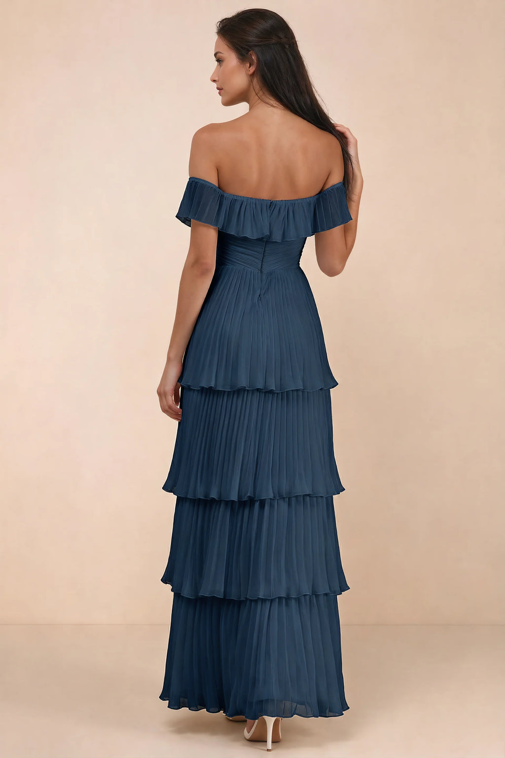 Rear studio view of Seraphina navy tiered ruffle maxi dress with a long flowing skirt