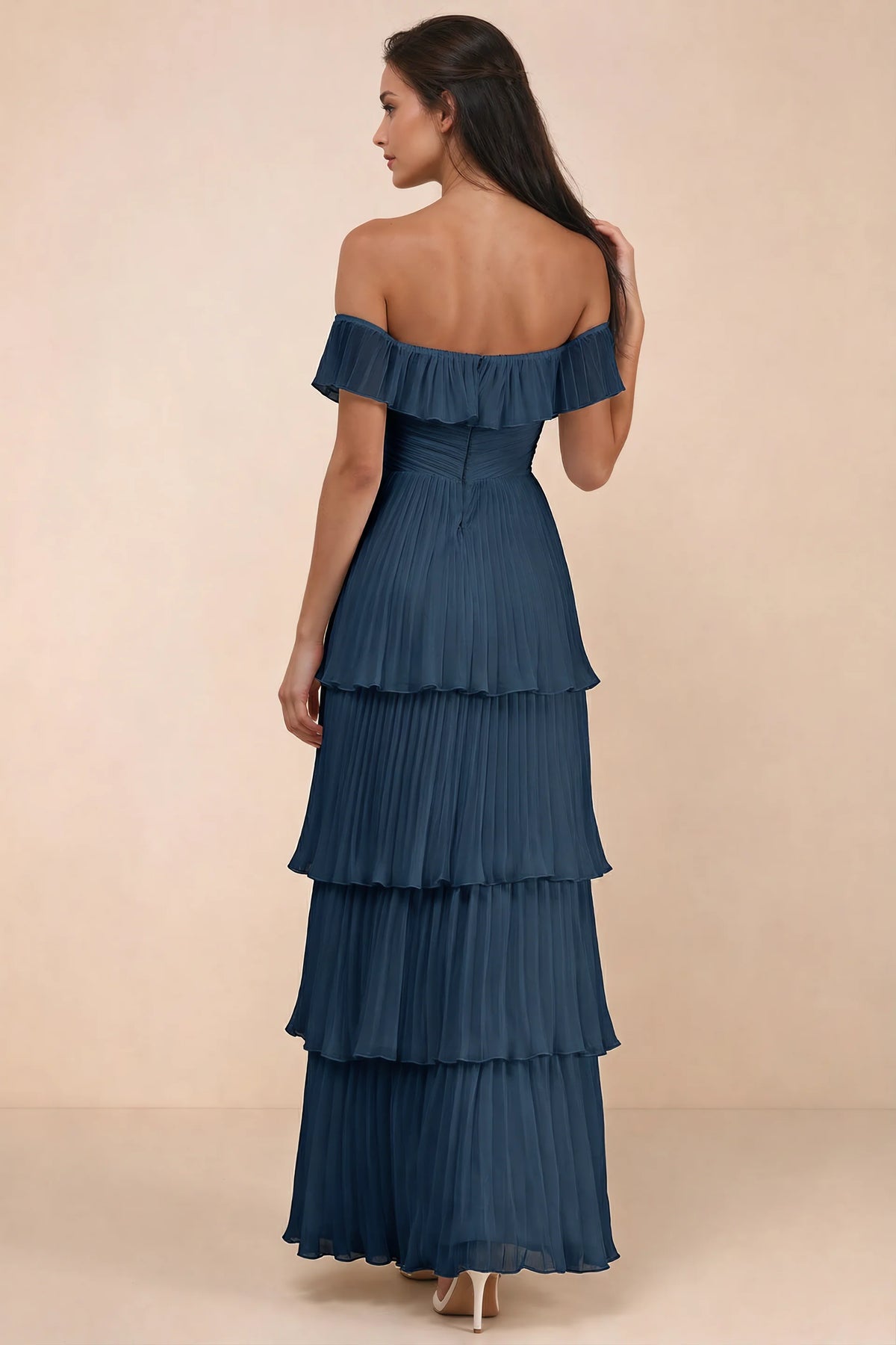 Rear studio view of Seraphina navy tiered ruffle maxi dress with a long flowing skirt