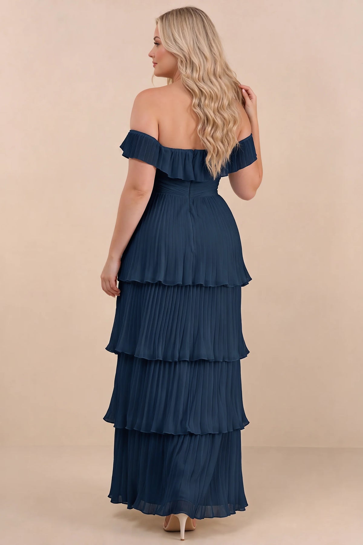 Rear view on a second model of Seraphina navy tiered ruffle maxi dress with a long flowing skirt