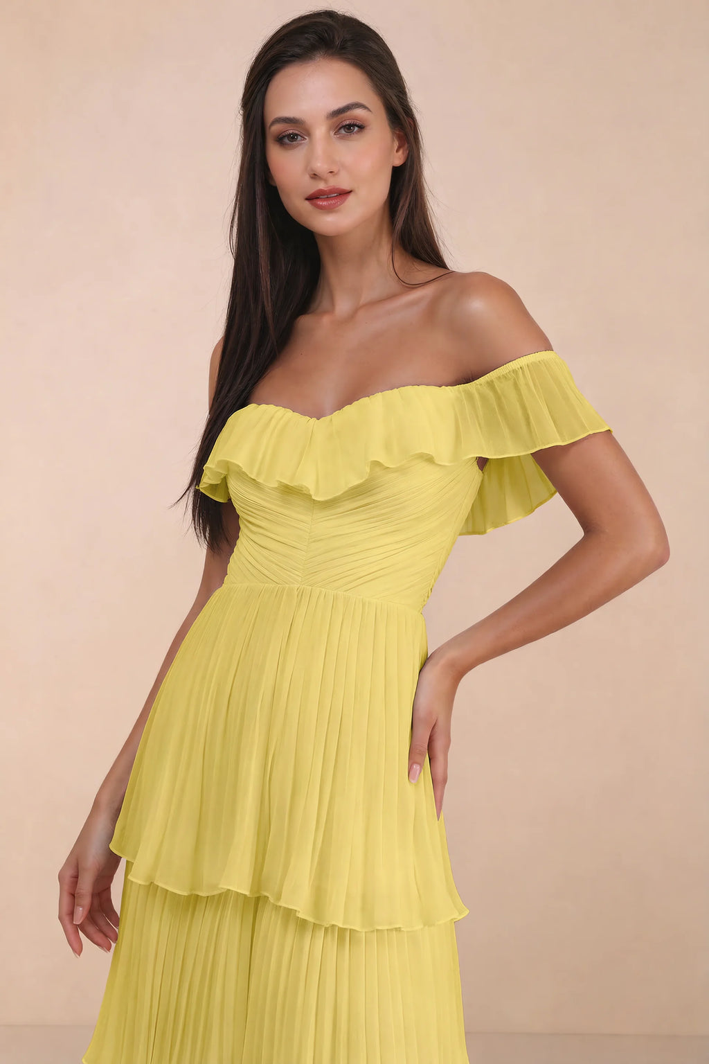 Close-up of shallow sweetheart neckline and off-shoulder ruffle and tiered skirt of Seraphina pastel yellow tiered ruffle maxi dress