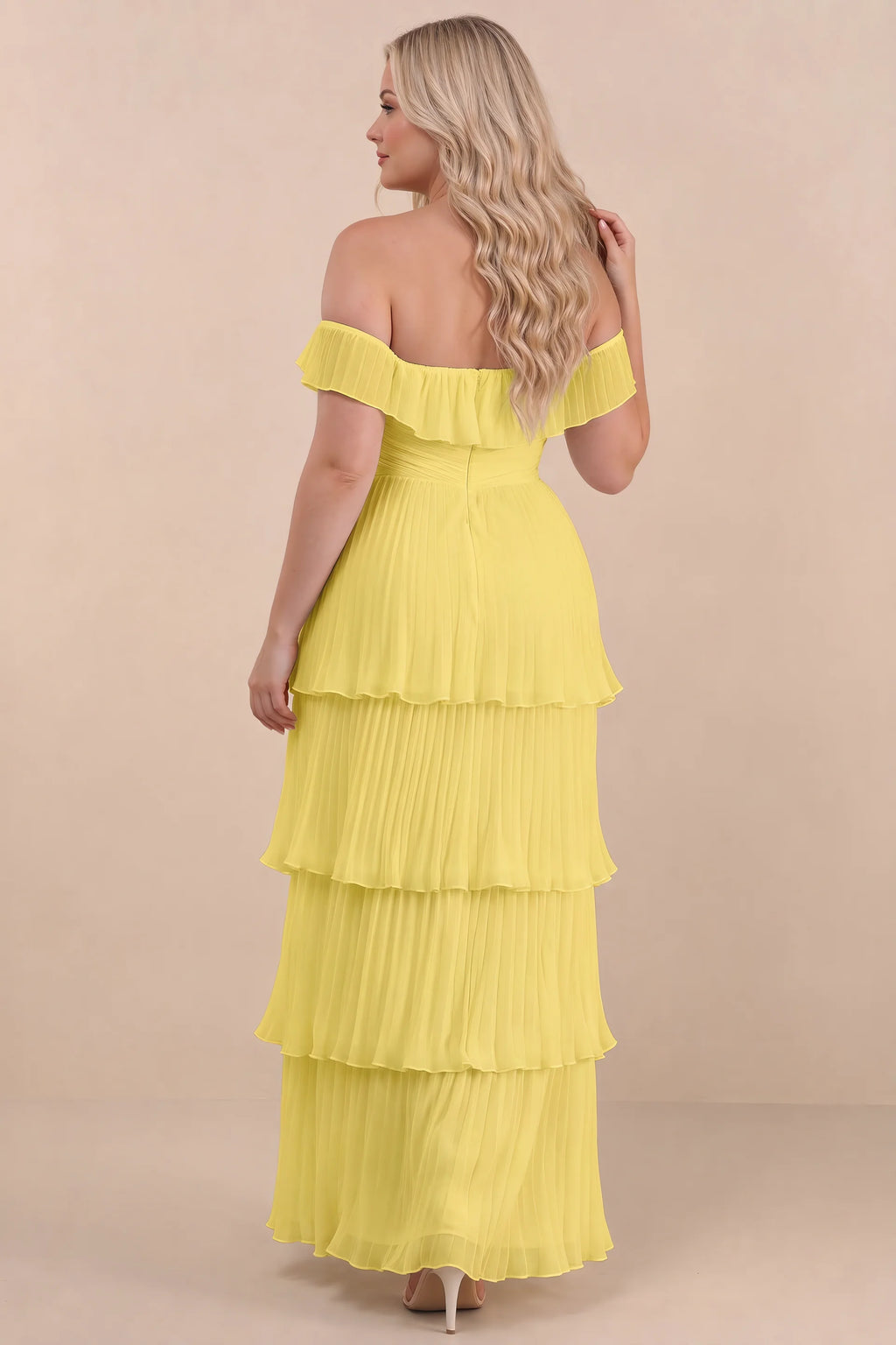 Rear view on a second model of Seraphina pastel yellow tiered ruffle maxi dress with a long flowing skirt