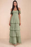 Front studio view of Seraphina pistachio tiered ruffle maxi dress with a long flowing skirt