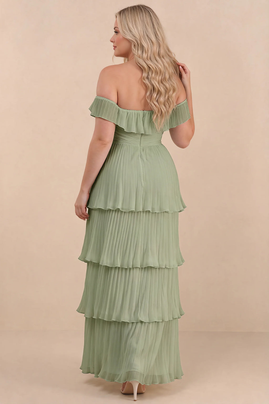 Rear view on a second model of Seraphina pistachio tiered ruffle maxi dress with a long flowing skirt