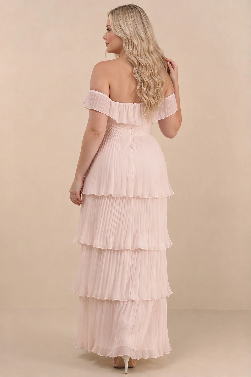 Rear view on a second model of Seraphina powder pink tiered ruffle maxi dress with a long flowing skirt