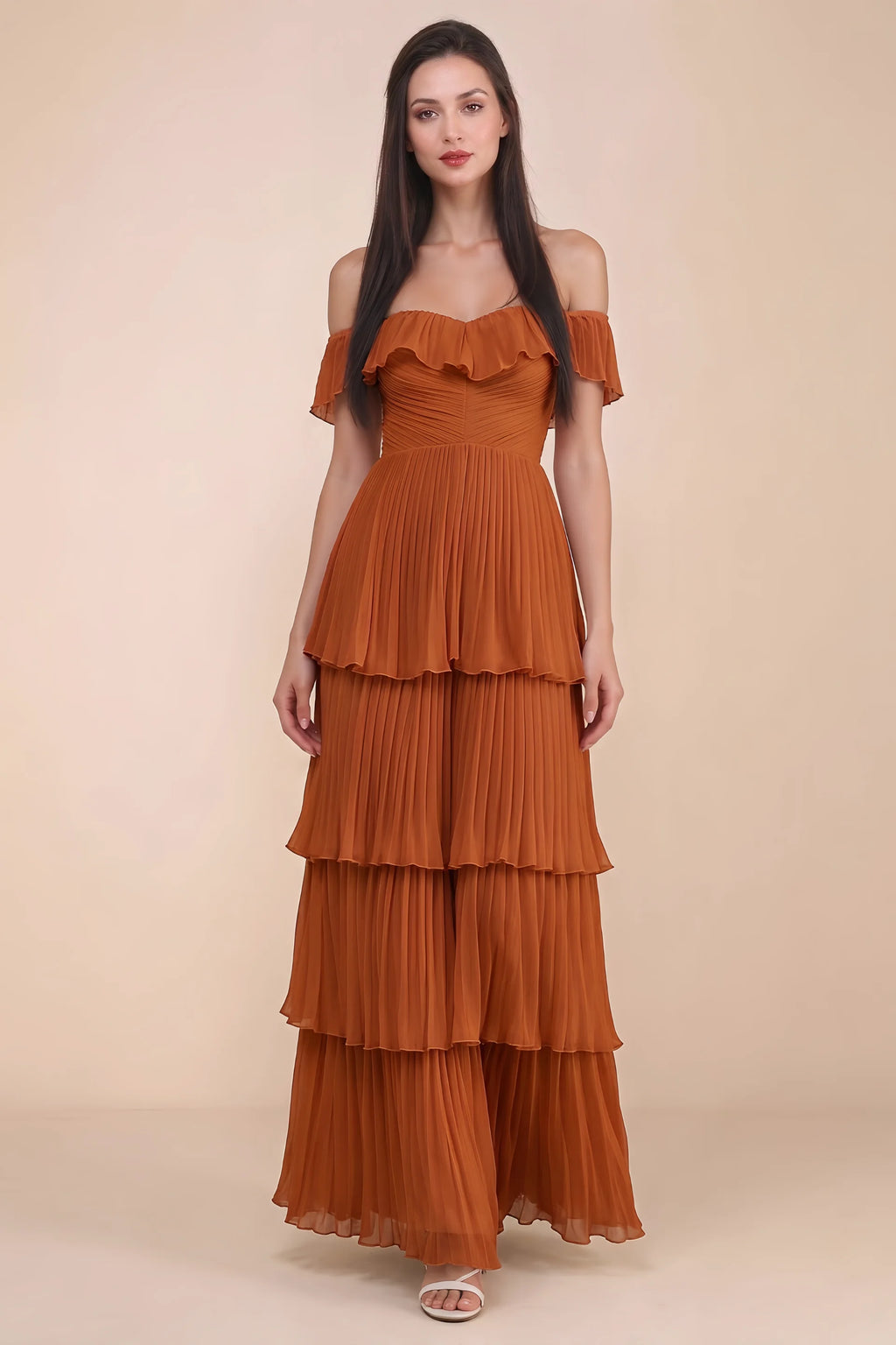 Front studio view of Seraphina rust tiered ruffle maxi dress with a long flowing skirt