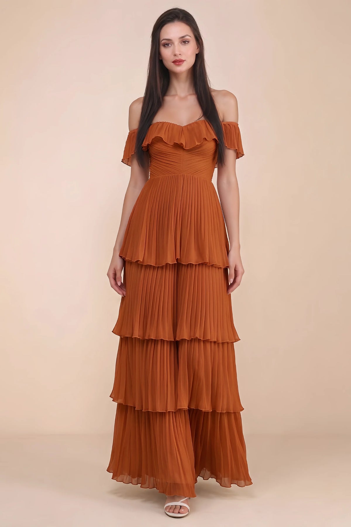 Front studio view of Seraphina rust tiered ruffle maxi dress with a long flowing skirt