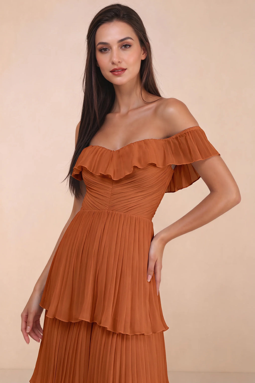 Close-up of shallow sweetheart neckline and off-shoulder ruffle and tiered skirt of Seraphina rust tiered ruffle maxi dress