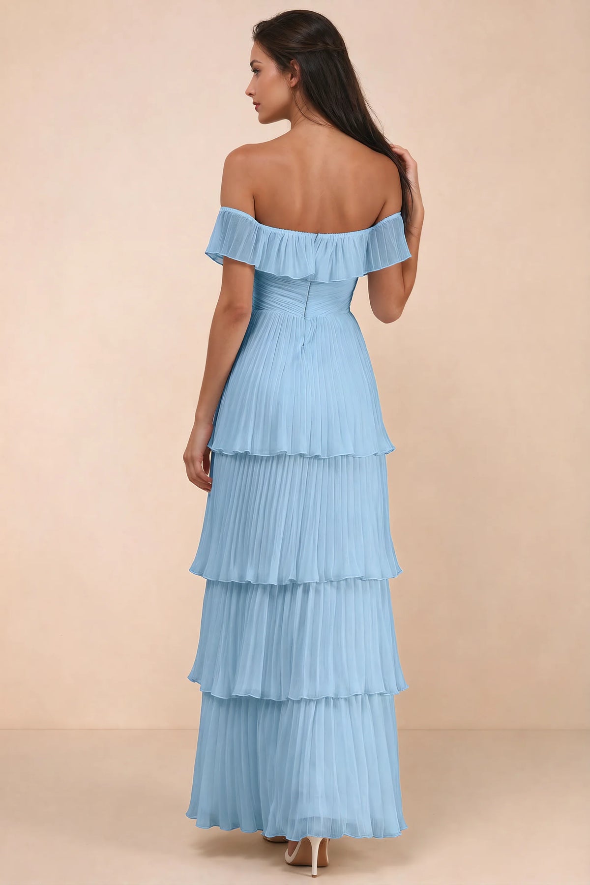 Rear studio view of Seraphina steel blue tiered ruffle maxi dress with a long flowing skirt