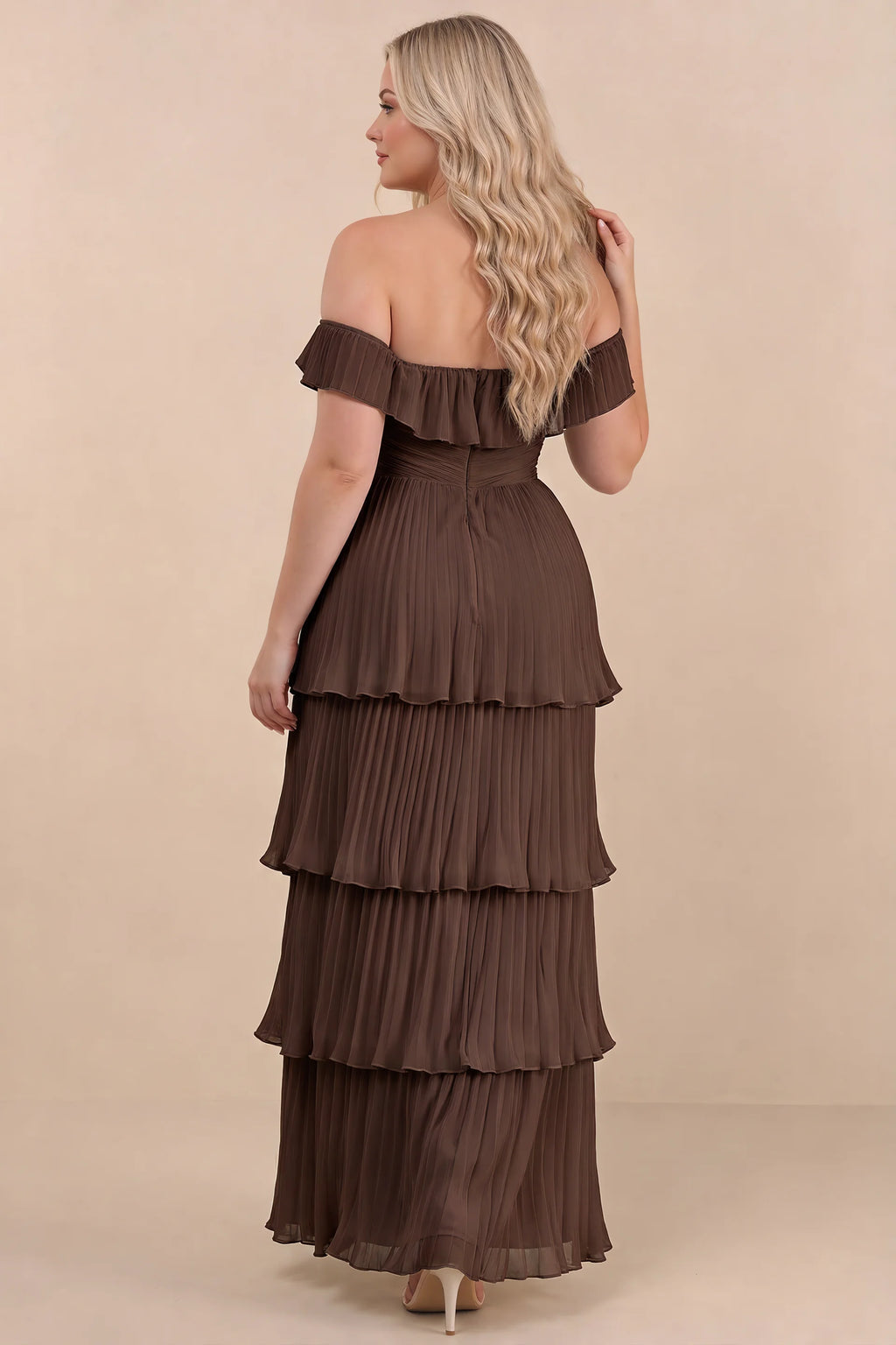Rear view on a second model of Seraphina truffle tiered ruffle maxi dress with a long flowing skirt
