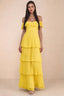 Front studio view of Seraphina yellow tiered ruffle maxi dress with a long flowing skirt