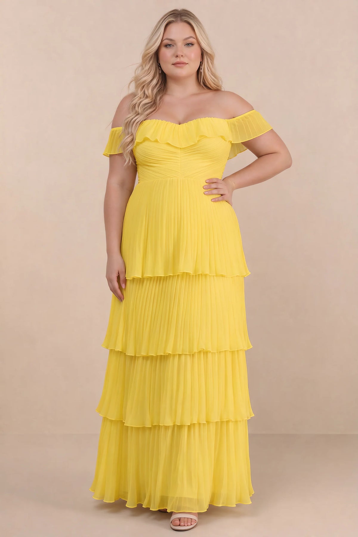 Front view on a second model of Seraphina yellow tiered ruffle maxi dress with a long flowing skirt