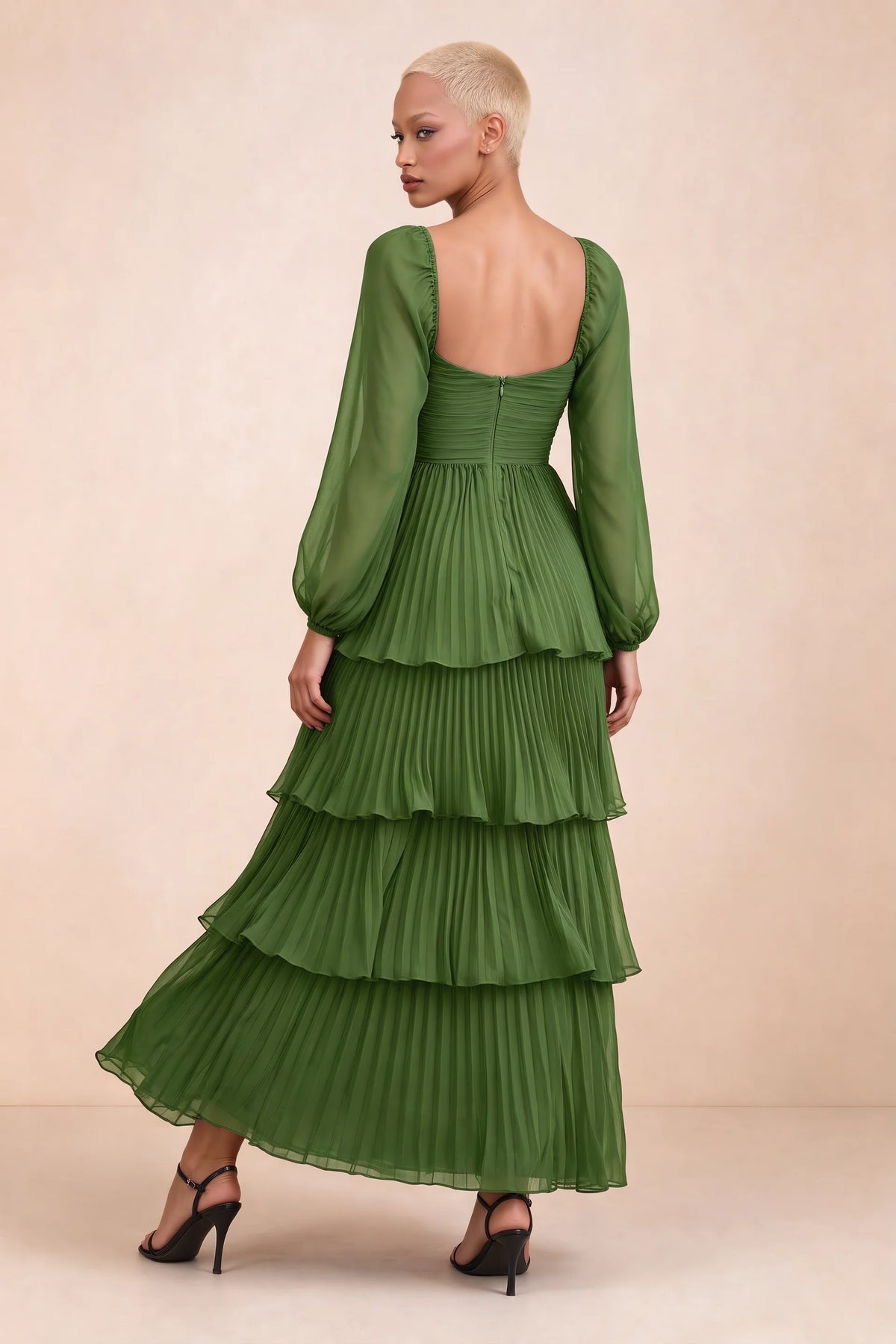Rear studio view of Sienna basil tiered pleated maxi dress with a long flowing skirt