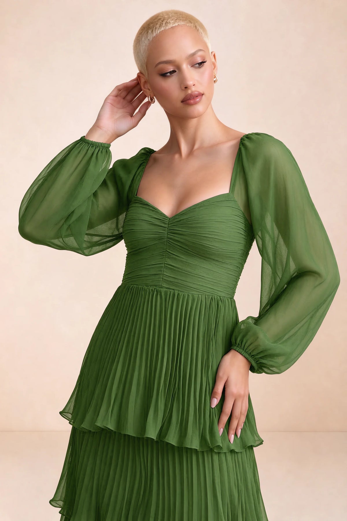 Close-up of sweetheart neckline, sheer sleeves and ruched waist of Sienna basil tiered pleated maxi dress