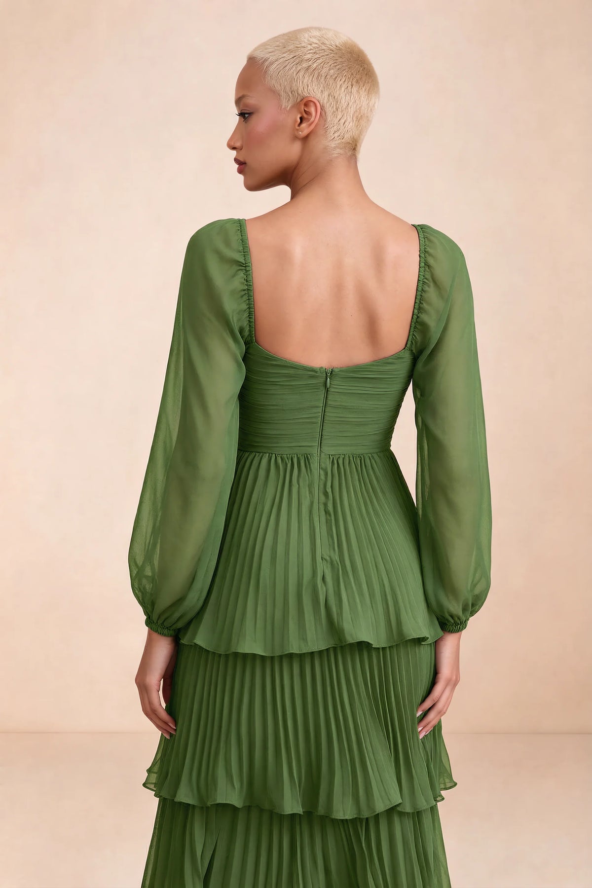 Close-up of low square back, sheer sleeves and centre-back zipper of Sienna basil tiered pleated maxi dress