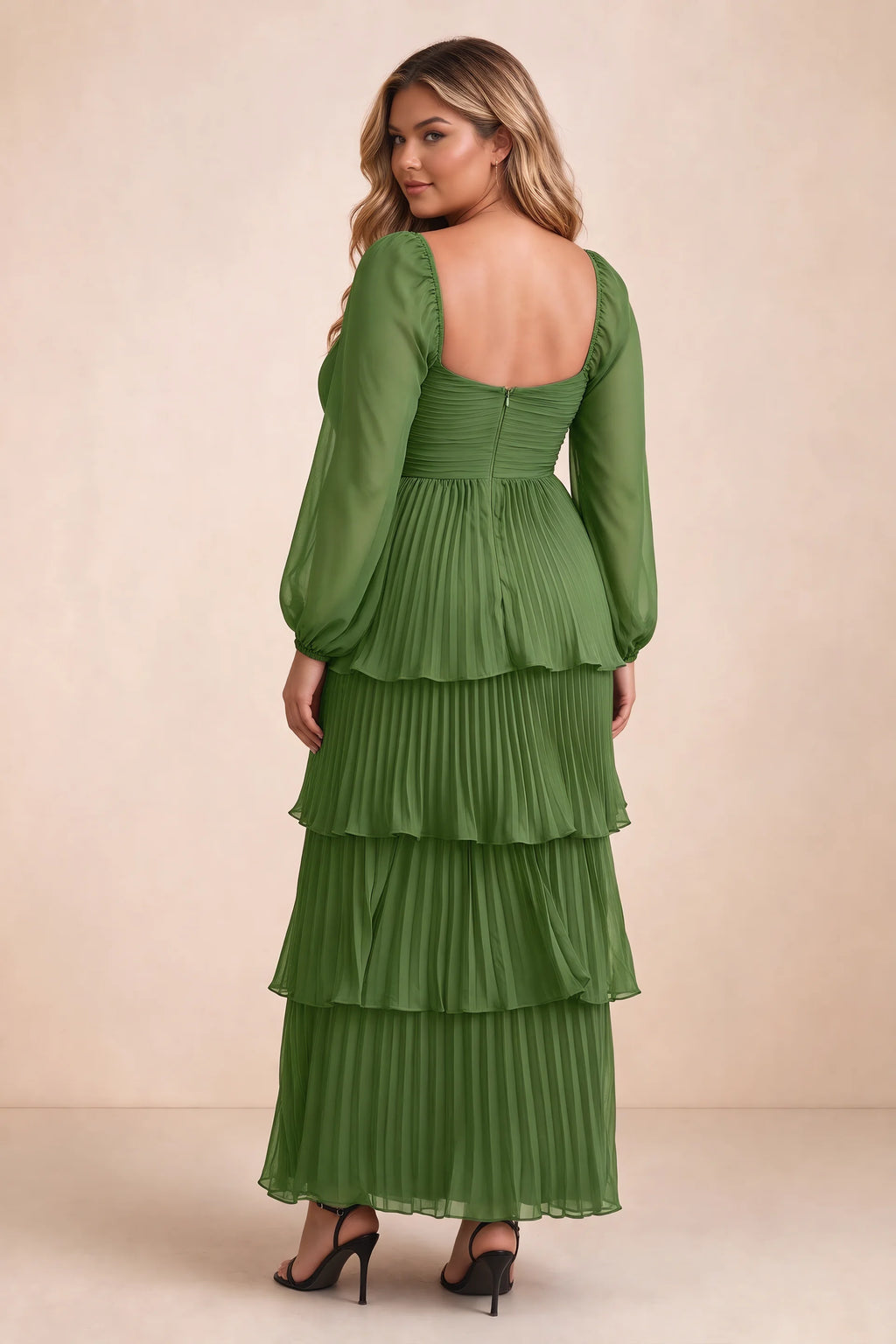 Rear view on a second model of Sienna basil tiered pleated maxi dress with a long flowing skirt