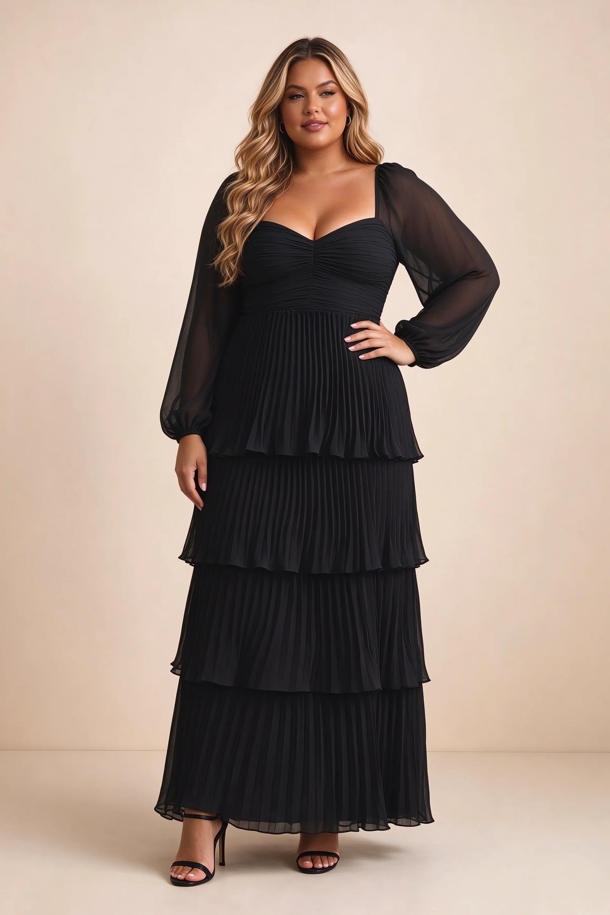 Front view on a second model of Sienna black tiered pleated maxi dress with a long flowing skirt