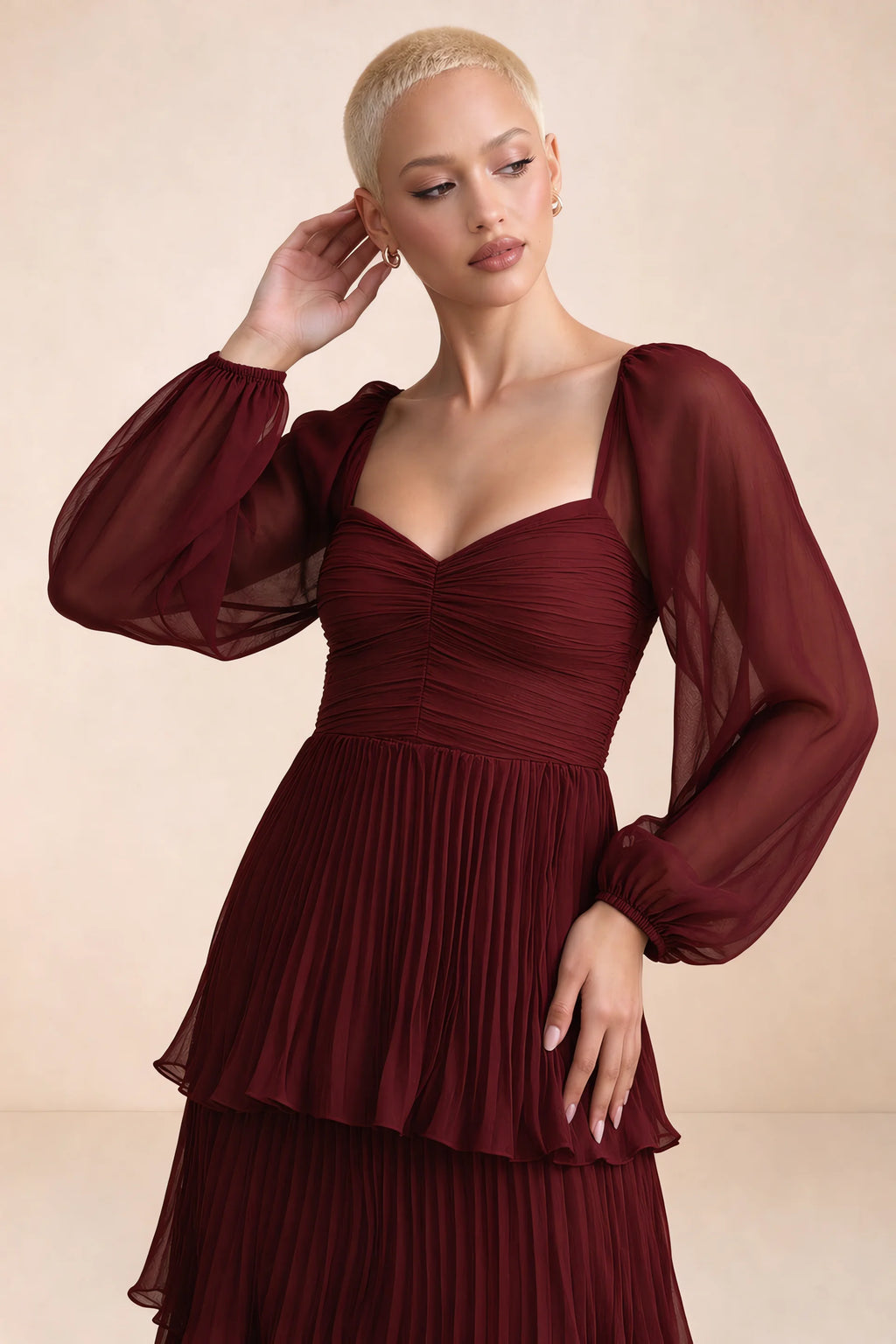 Close-up of sweetheart neckline, sheer sleeves and ruched waist of Sienna burgundy tiered pleated maxi dress