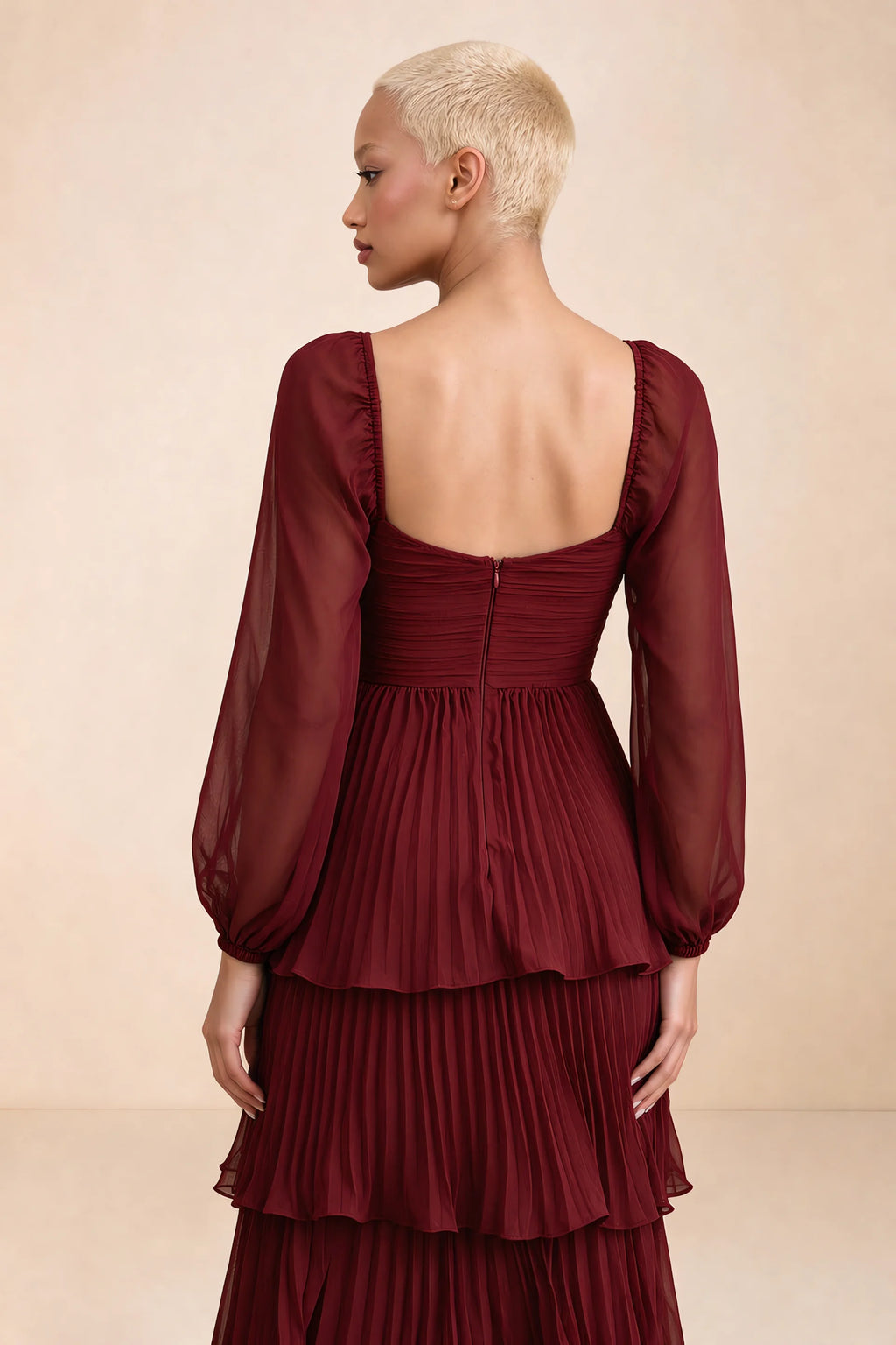 Close-up of low square back, sheer sleeves and centre-back zipper of Sienna burgundy tiered pleated maxi dress