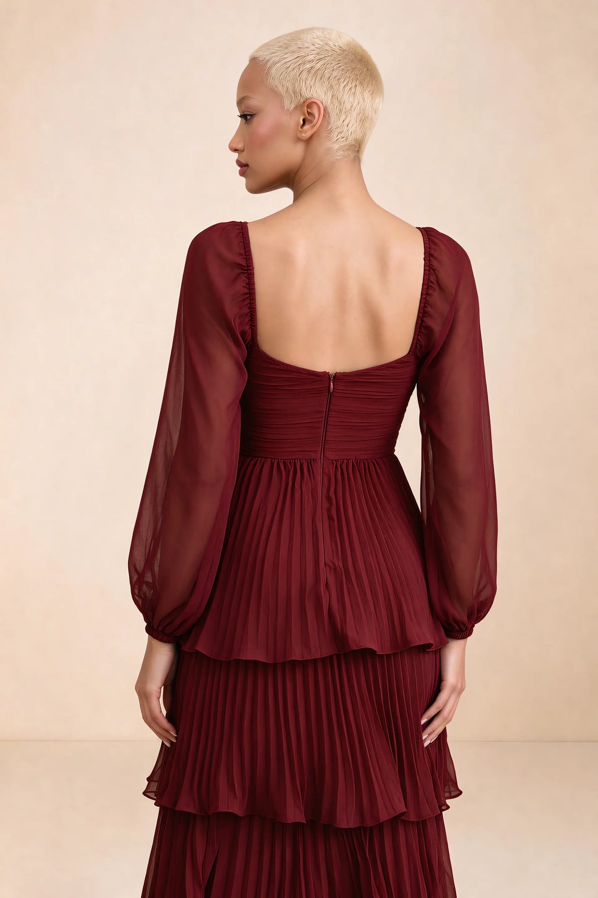 Close-up of low square back, sheer sleeves and centre-back zipper of Sienna burgundy tiered pleated maxi dress