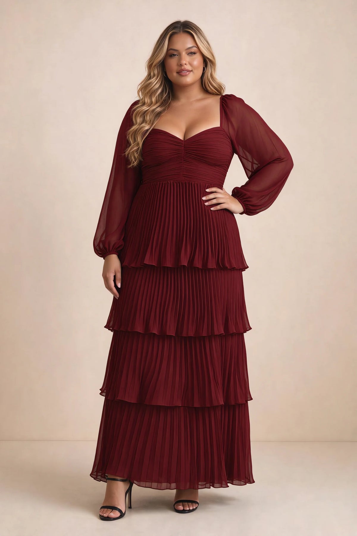 Front view on a second model of Sienna burgundy tiered pleated maxi dress with a long flowing skirt