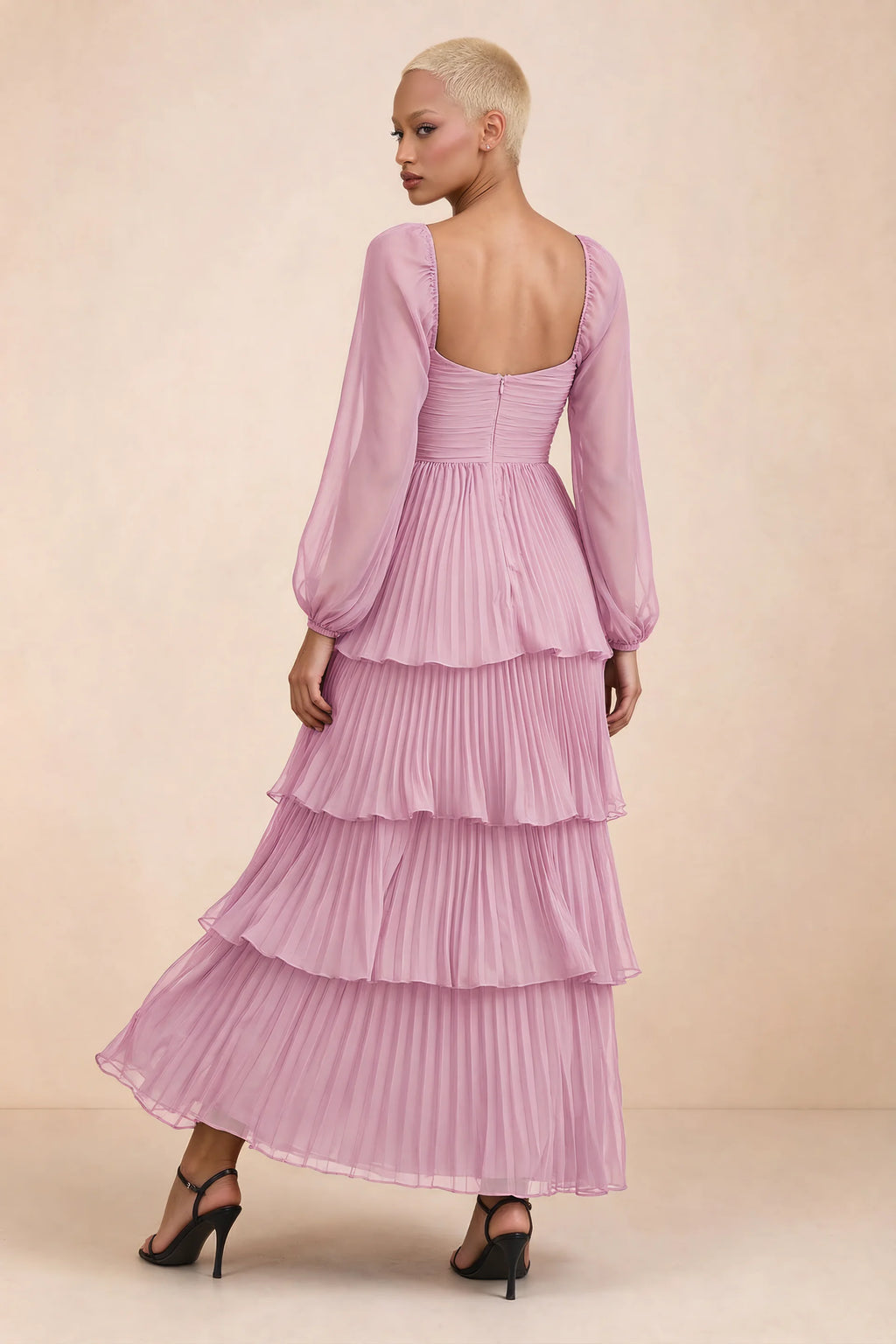 Rear studio view of Sienna candy pink tiered pleated maxi dress with a long flowing skirt