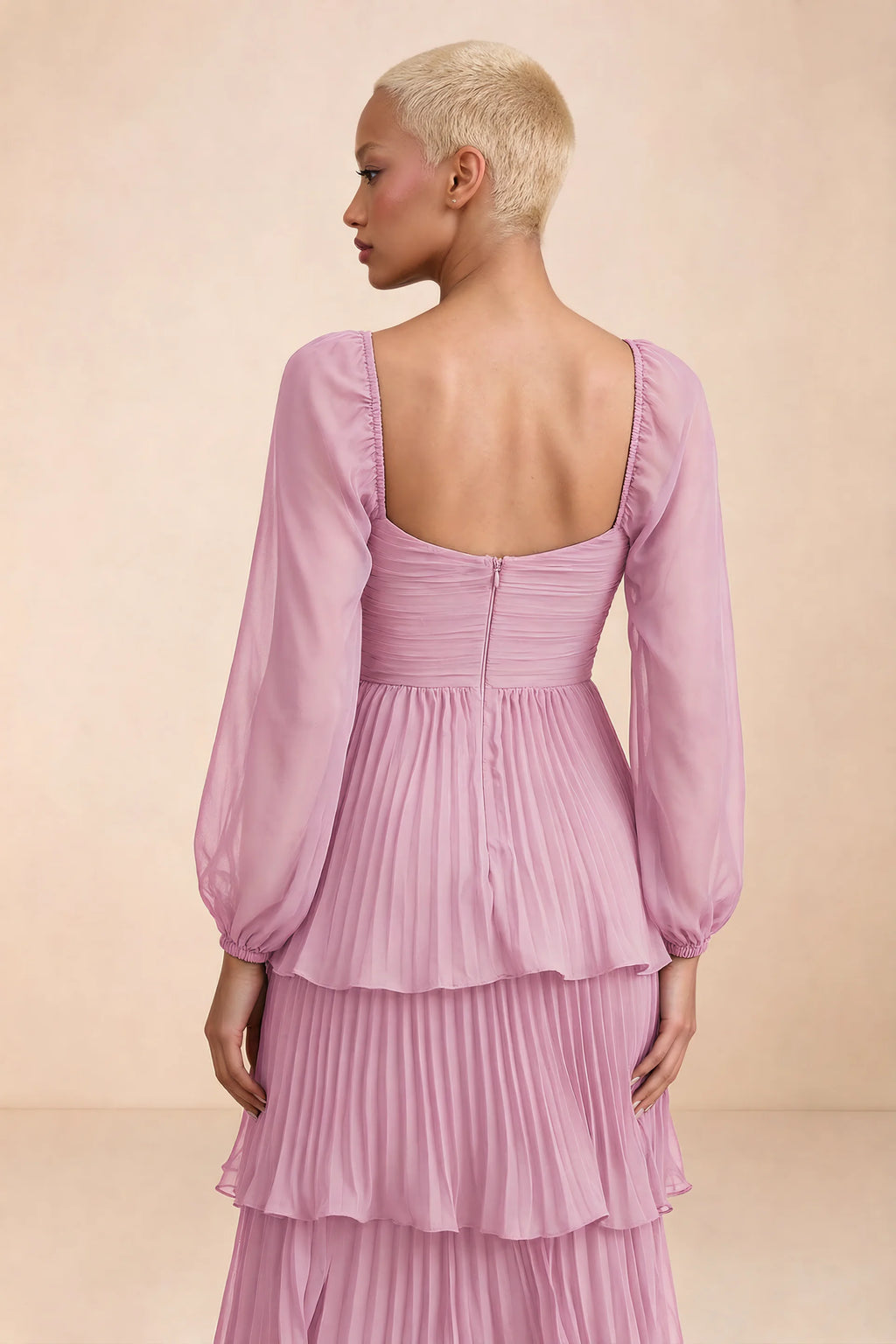 Close-up of low square back, sheer sleeves and centre-back zipper of Sienna candy pink tiered pleated maxi dress