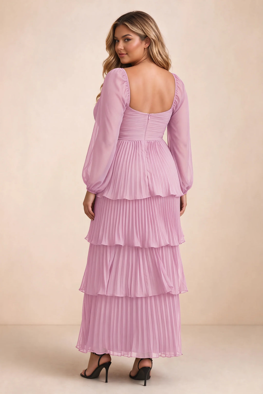 Rear view on a second model of Sienna candy pink tiered pleated maxi dress with a long flowing skirt