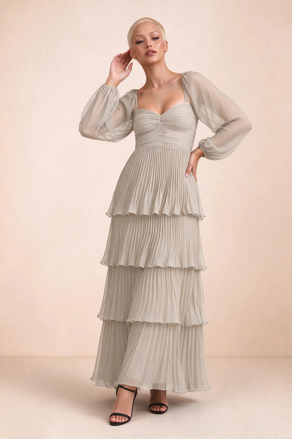 Front studio view of Sienna cream tiered pleated maxi dress with a long flowing skirt